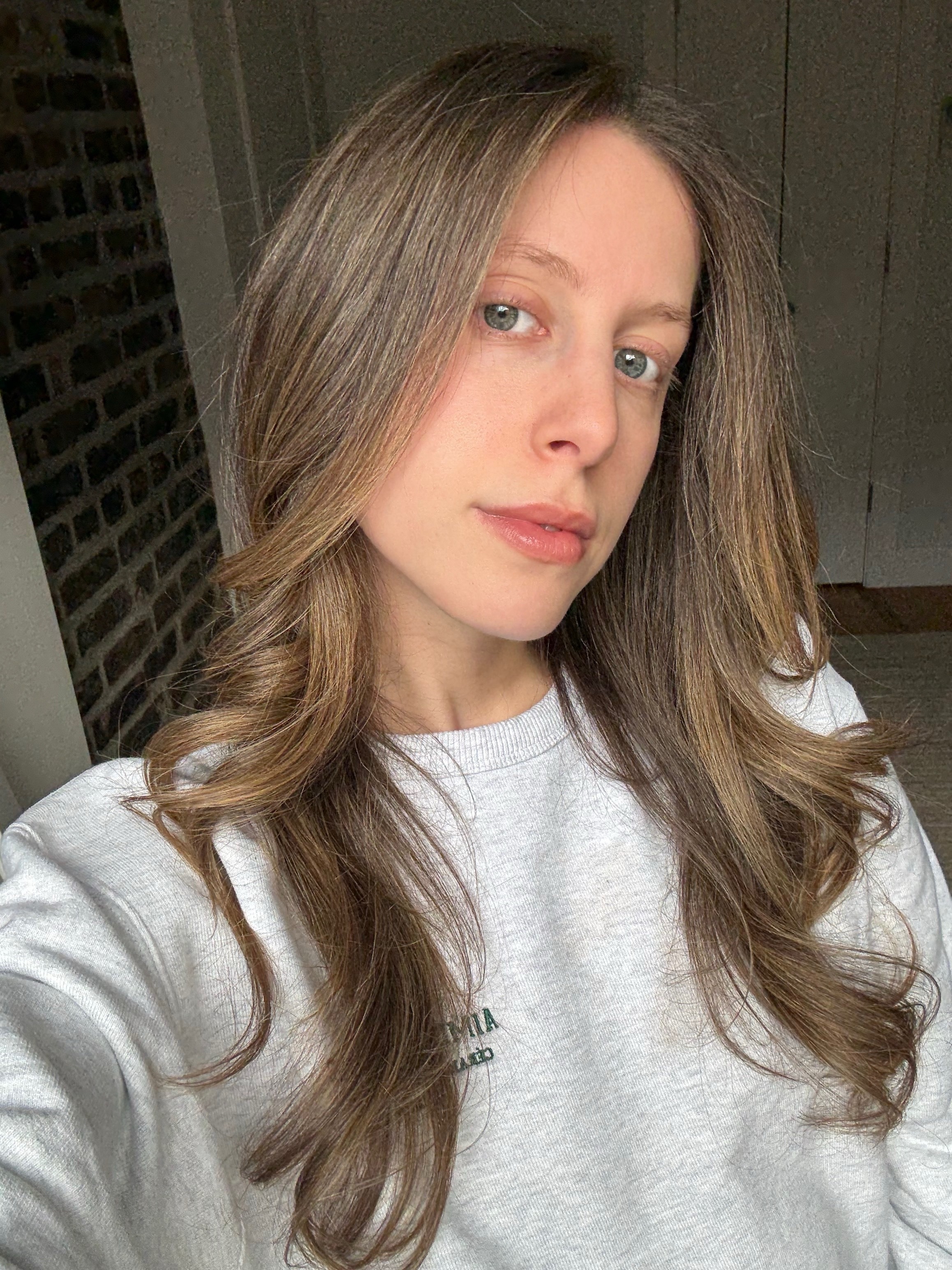 Photo of Jamie Schneider testing the R&amp;#333;z Salt Scalp Scrub