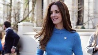 The Duchess of Cambridge pictured on the street in a blue jumper with glowing skin and a blow dry