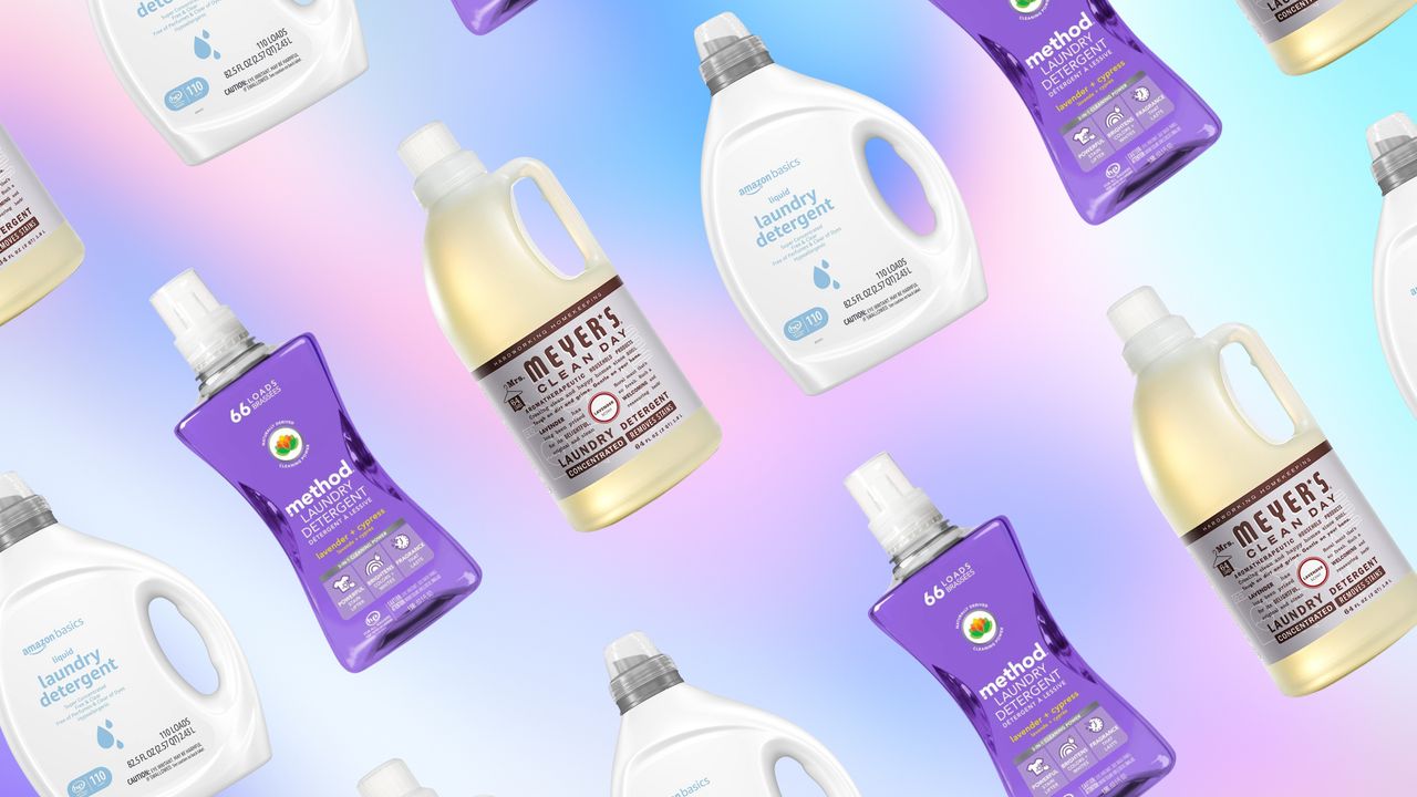 Bottles of laundry detergent on purple pastel background