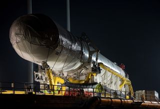 Antares Rocket Rolls Out in Darkness