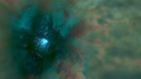 A blue scene with hazy bits of gas. In the middle-left of the image, there's a very sparkly blue area.