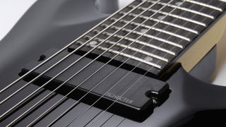 Close up of an 8-string guitar pickup