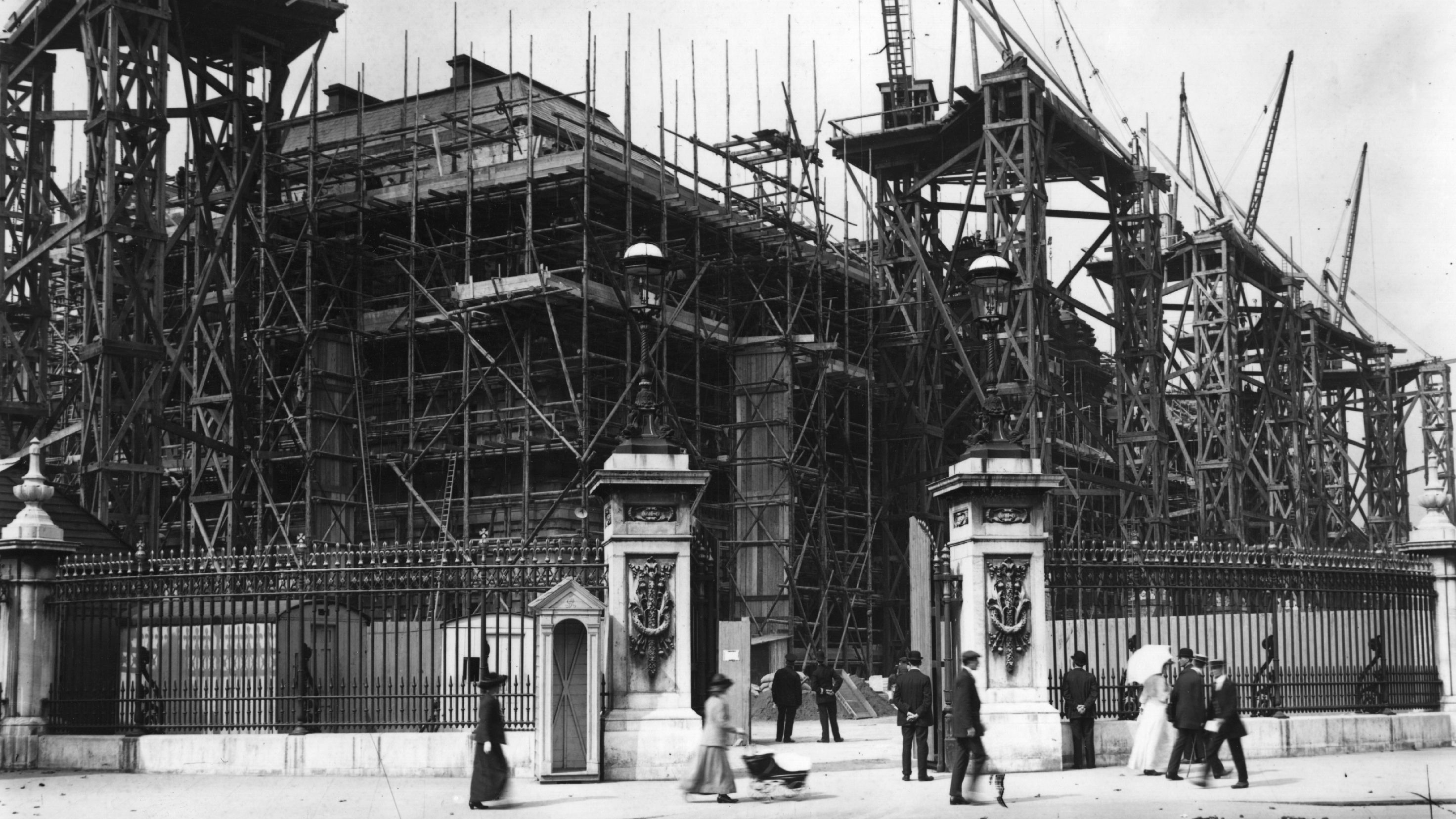 Buckingham Palace barely visible beneath a veil of scaffolding during its reconstruction