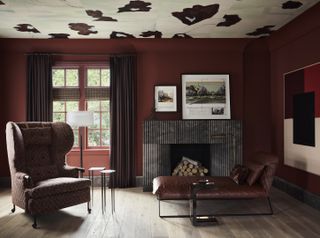 dark brown living room with patterned ceiling