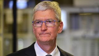 Tim Cook looking pensive in a suit