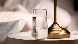 Glass of water on nightstand