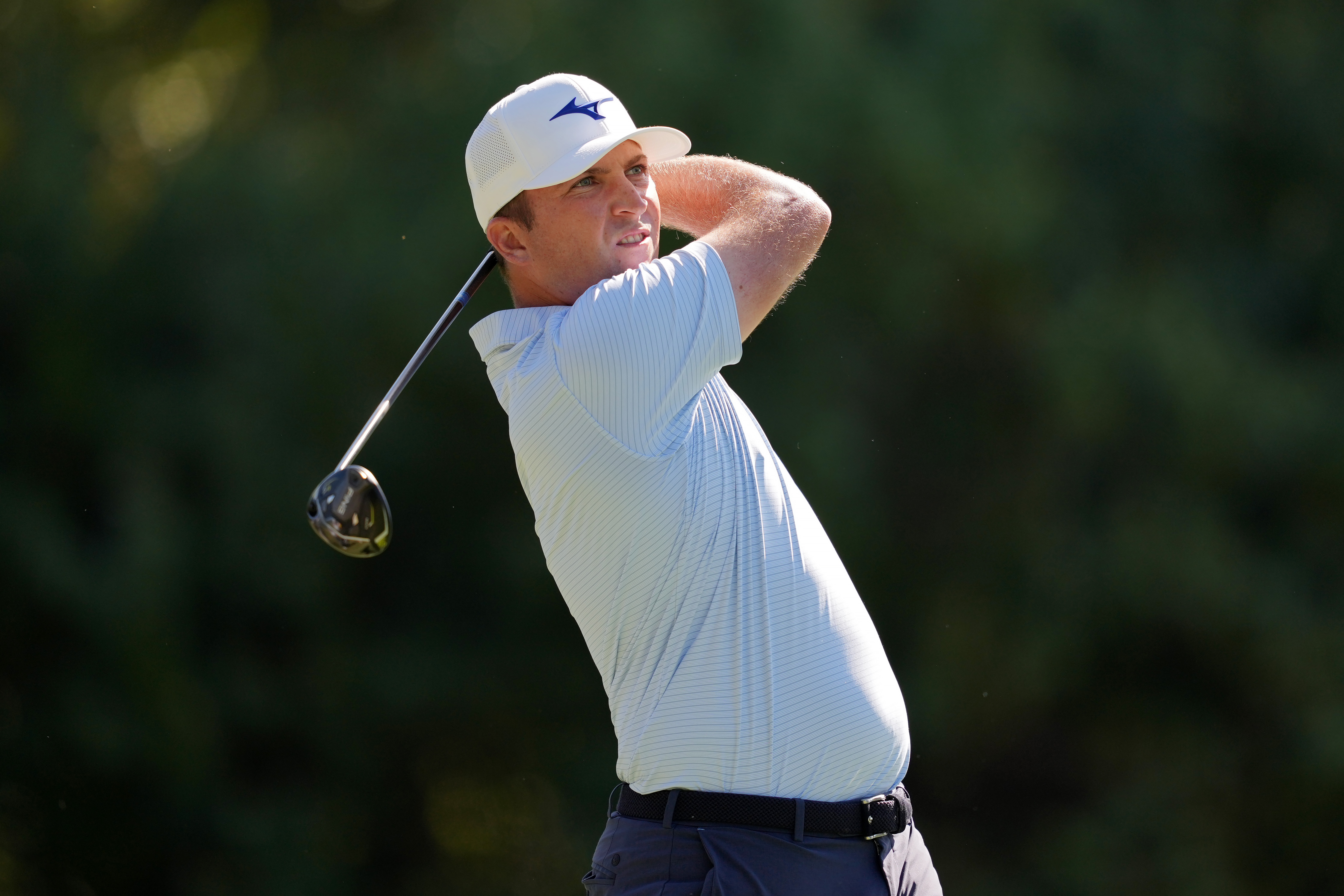 Steven Fisk hits a fairway wood from the fairway