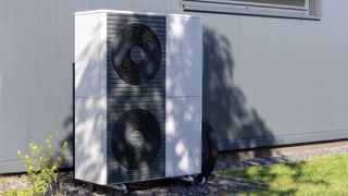 heat pump outside grey building