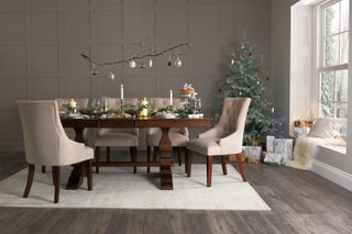 a dining room at christmas with wall panelling