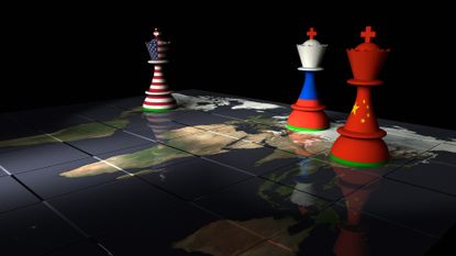 Chess pieces with national flags in a standoff on a world map