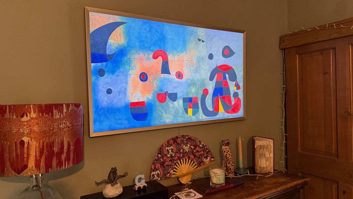 The Samsung Frame TV showing art work in a living room.