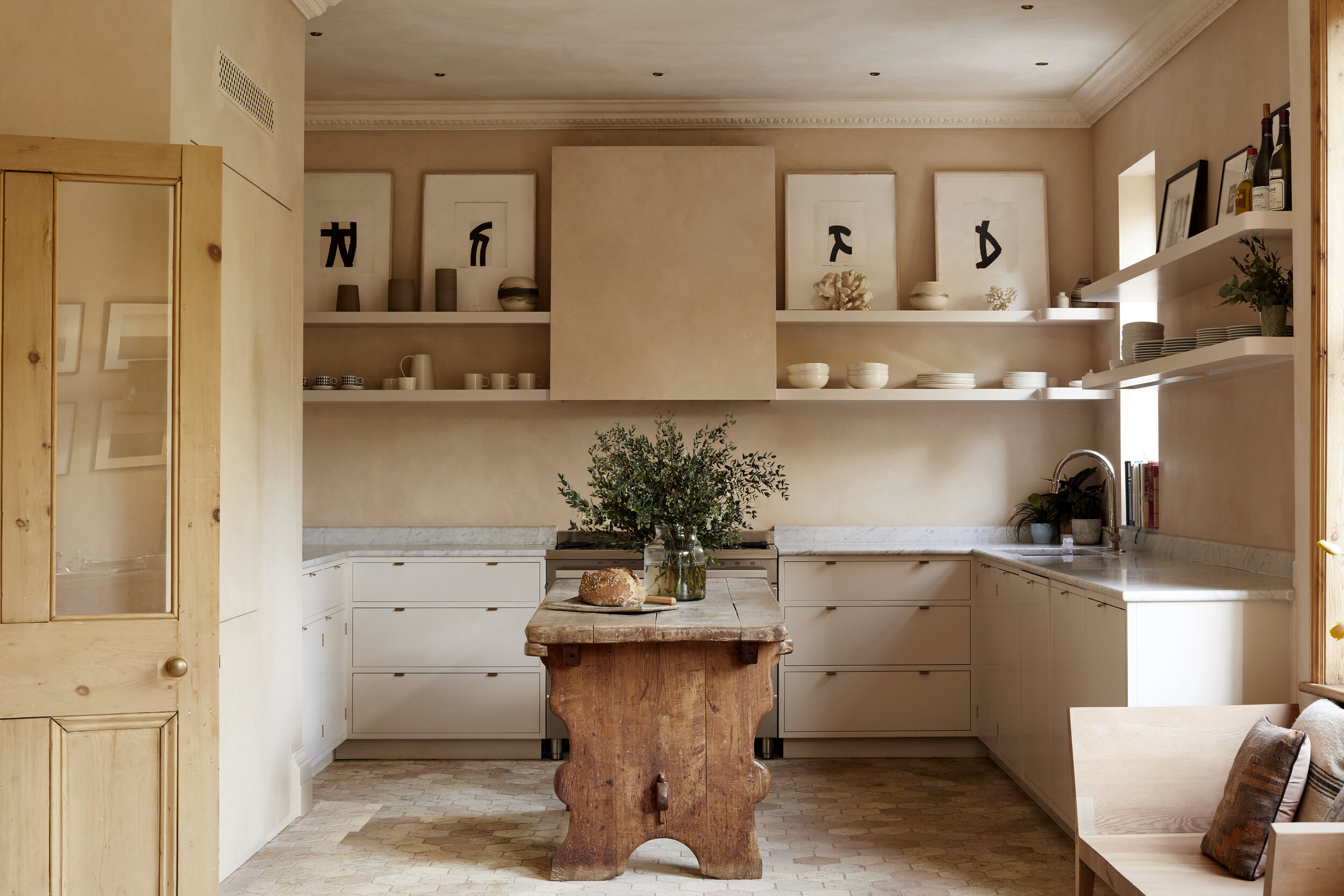 Natural stone tile kitchen with wooden island