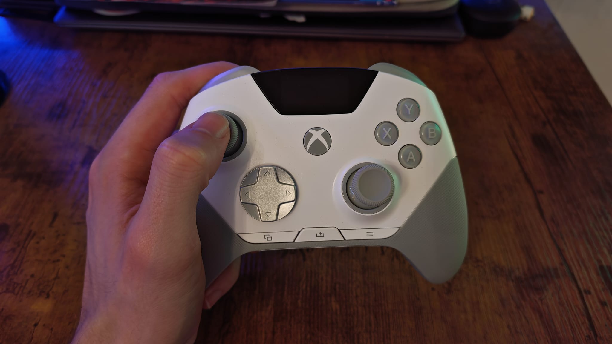 A reviewer holding the SteelSeries Aeon Pro