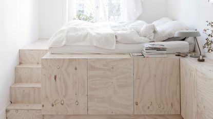 a loft bed on a raised platform