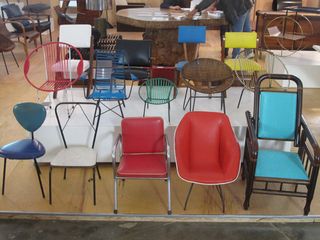 A colourful spread of vintage children’s chairs