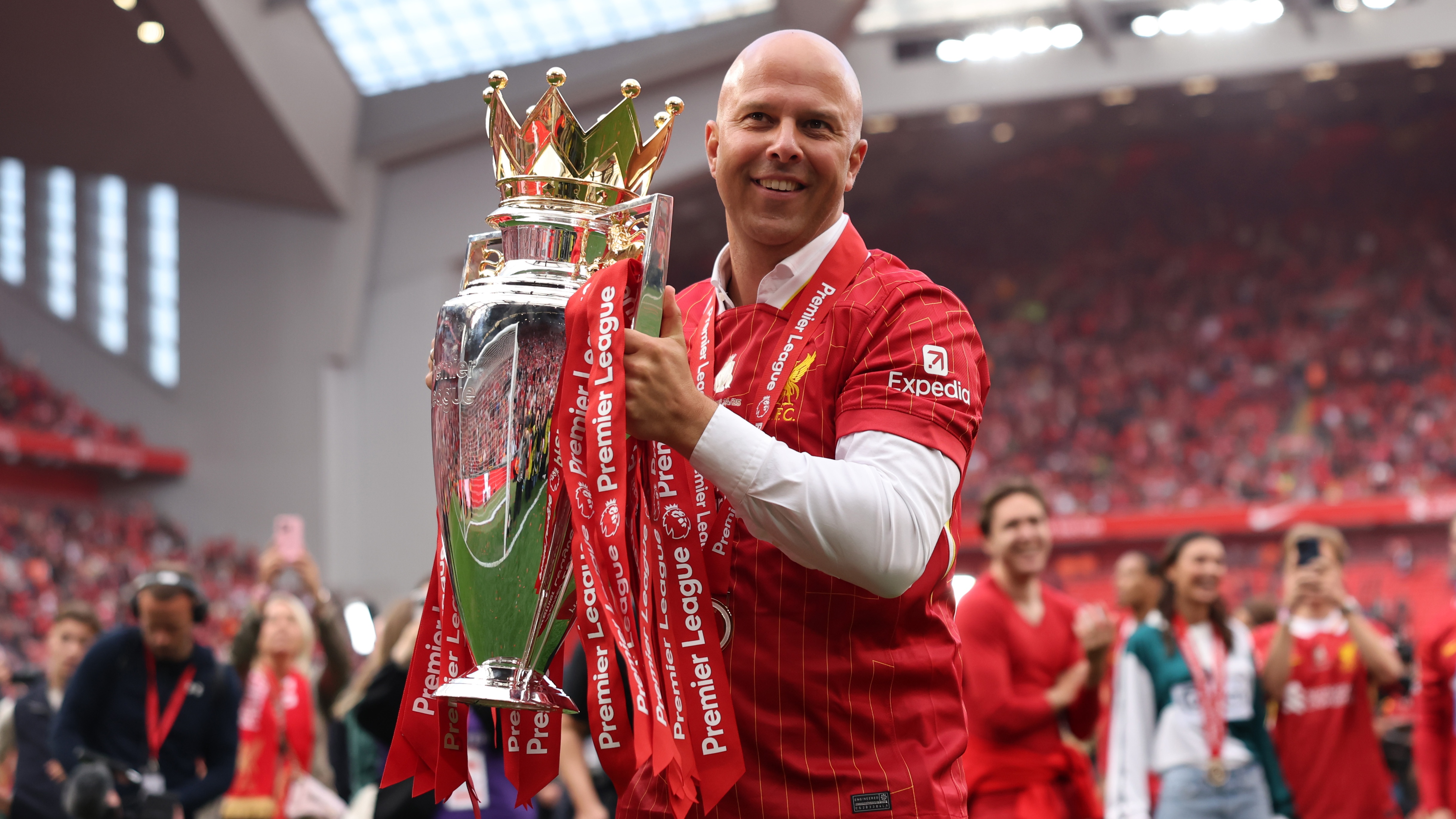 Arne Slot, Manager of Liverpool, celebrates with the Premier League trophy, as Liverpool are crowned the Champions of the Premier League for the 2024/25 Season, following the Premier League match between Liverpool FC and Crystal Palace FC at Anfield on May 25, 2025 in Liverpool, England. 