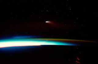 An astronaut at the International Space Station captured this image of Comet Hale-Bopp at sunset on Sept. 18, 2012.