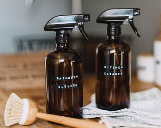 kitchen and bathroom cleaner in homemade bottles - daiga ellaby - unsplash