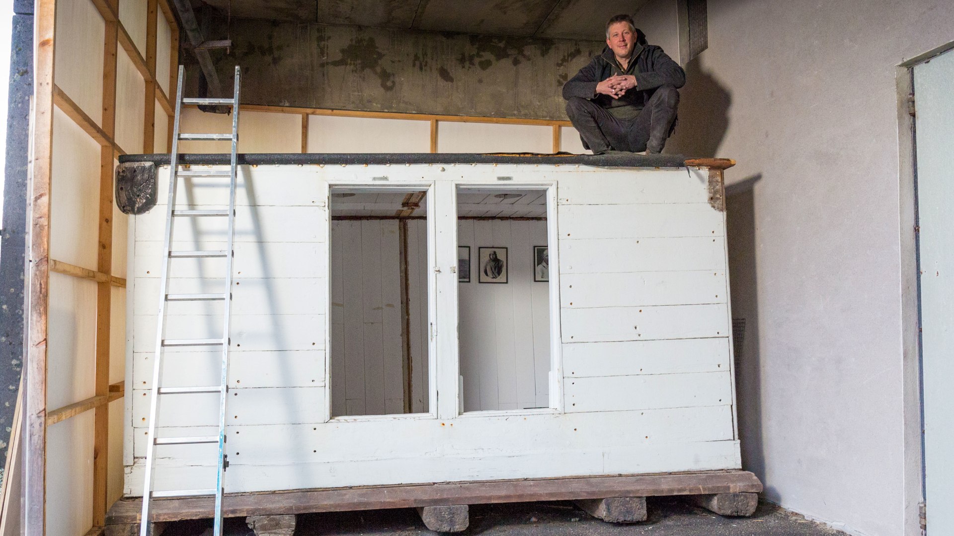 Sven Habermann sitting on the cabin.