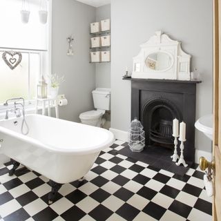 bathroom with fireplace and black and white checkerboard floor