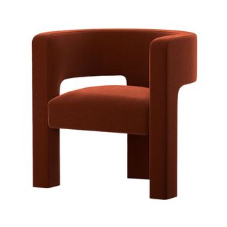 Dark orange velvet sculpted chair with rounded back and arms