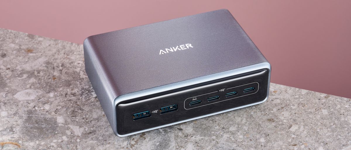 Anker Prime Charger (200W, 6 ports, GaN) on stone surface against pink background