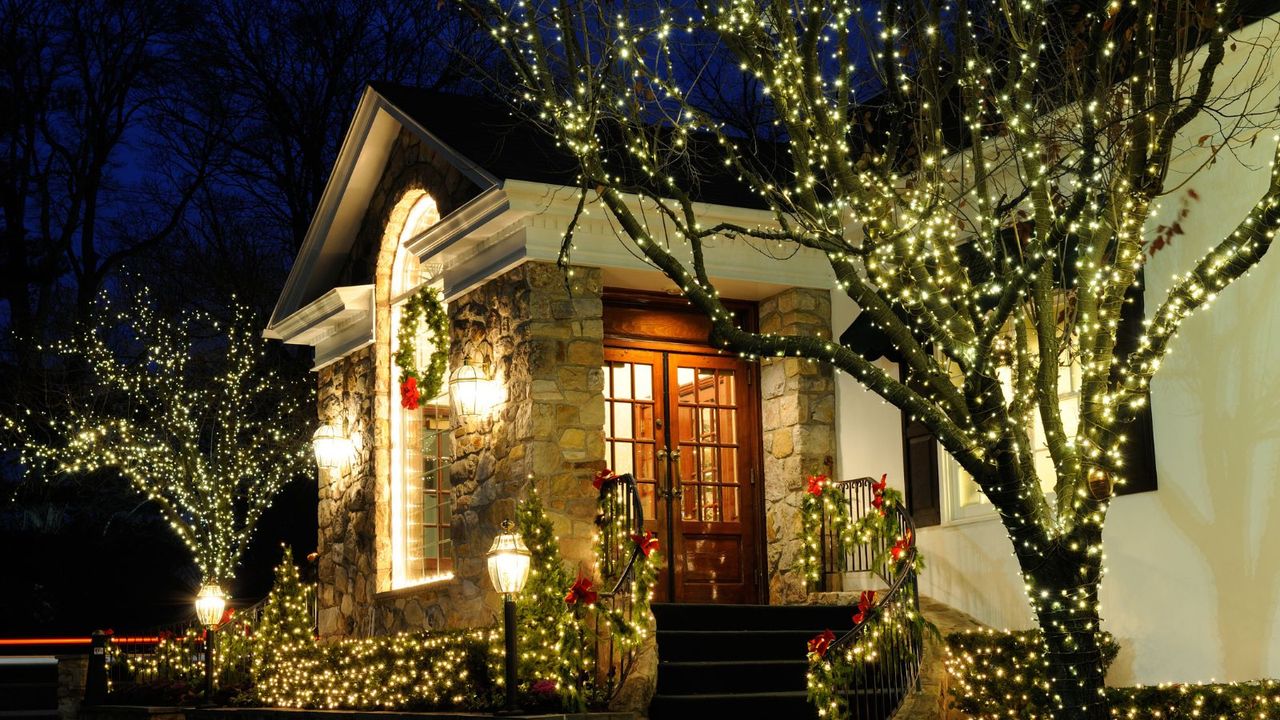 Christmas lights in front of a porch 