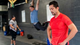 Man wearing T-shirt catches his breath after exercise