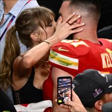 Taylor Swift kissing Travis Kelce