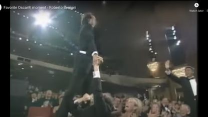 1999: When Roberto Benigni stood up on the theater seats.