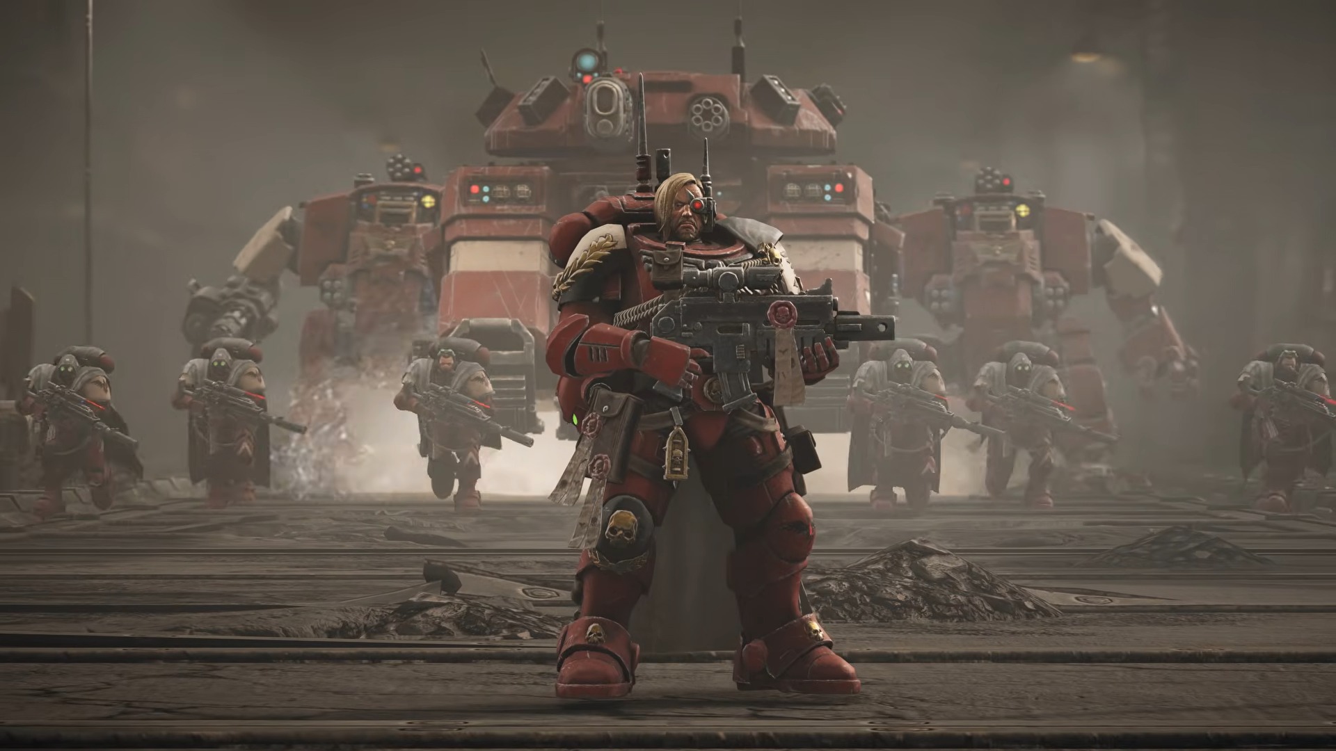 A heavily armored sci-fi soldier stands with a rifle before a massive red war machine, as troops advance through a dusty, smoke-filled battlefield.
