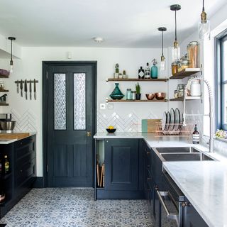 kitchen with dark blue cabinet and granite countertop