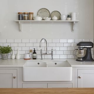 white butler sink with white tile splashback