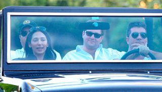 Simon Cowell and Lauren Silverman drive around LA in 2012