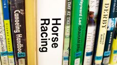 Horse racing books on a library shelf
