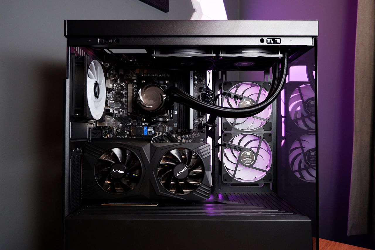 An iBuyPower gaming PC being set up on a desktop.