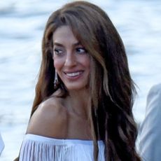 Amal Clooney arrived in Lake Como wearing a fringed white dress