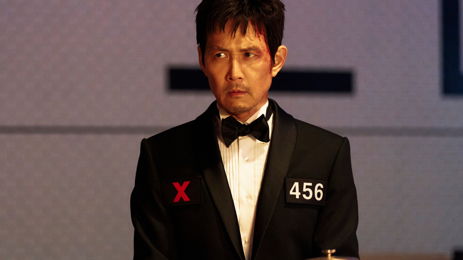 Player 456 wears a suit in Squid Game season 3