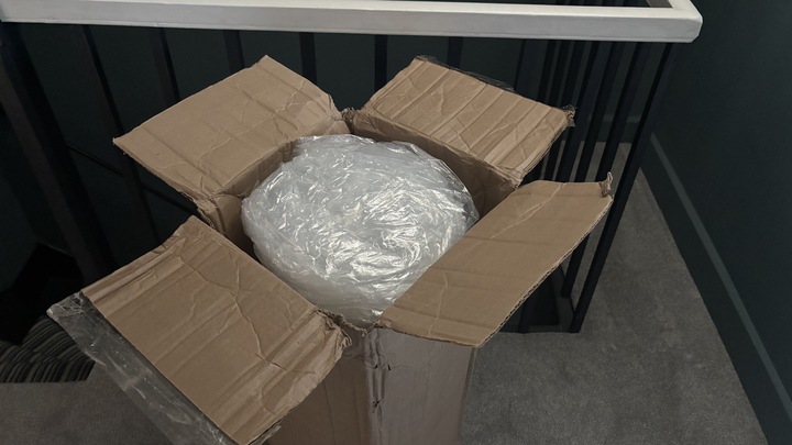 The Helix Premium Memory Foam Mattress Topper with GlacioTex in its box