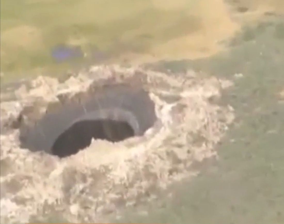 A Siberian hole that opened up mysteriously and was reported in July 2014.