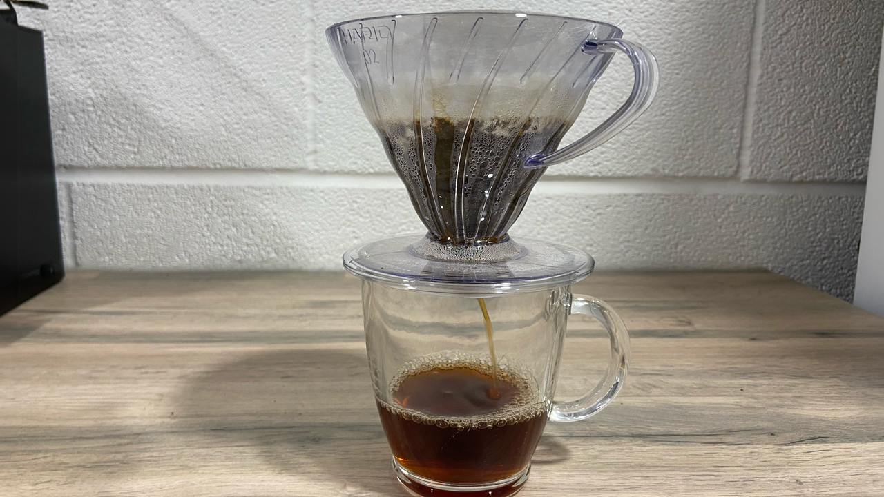 a photograph of the Hario V60 being used to brew coffee