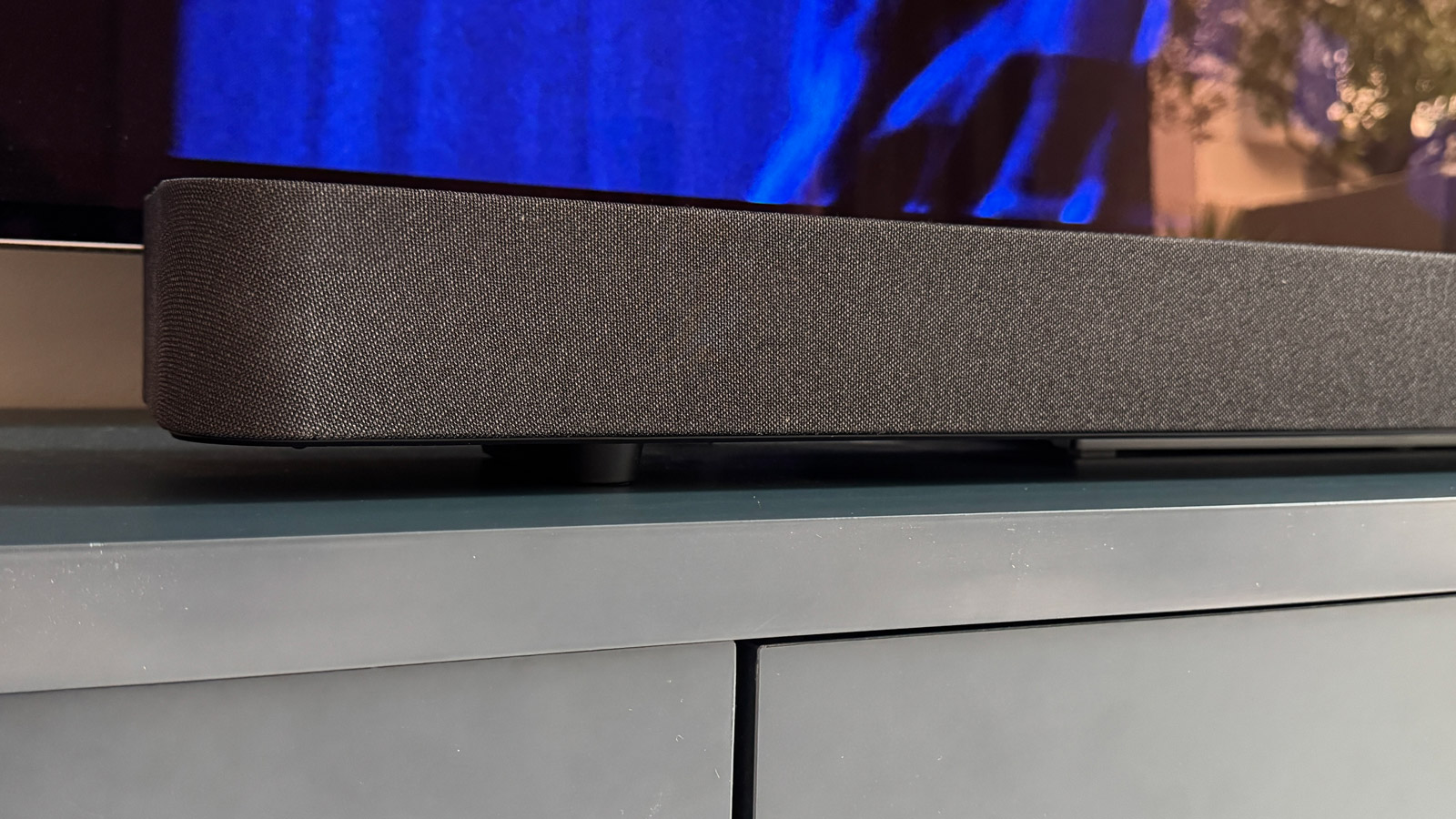 Sony Bravia Theater Bar 8 soundbar with feet attached and sitting in front of the LG G4 OLED TV