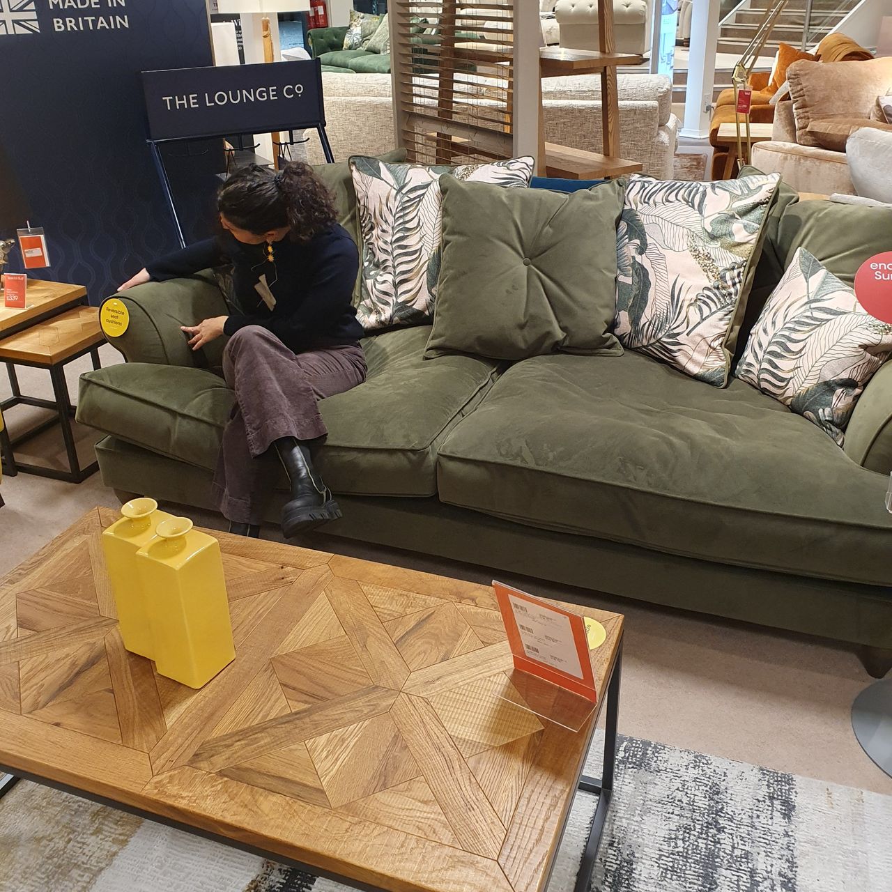 Sara sitting on The Lounge Co Bronwyn sofa for Furniture Village