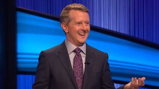 Ken Jennings smiling and hosting Jeopardy