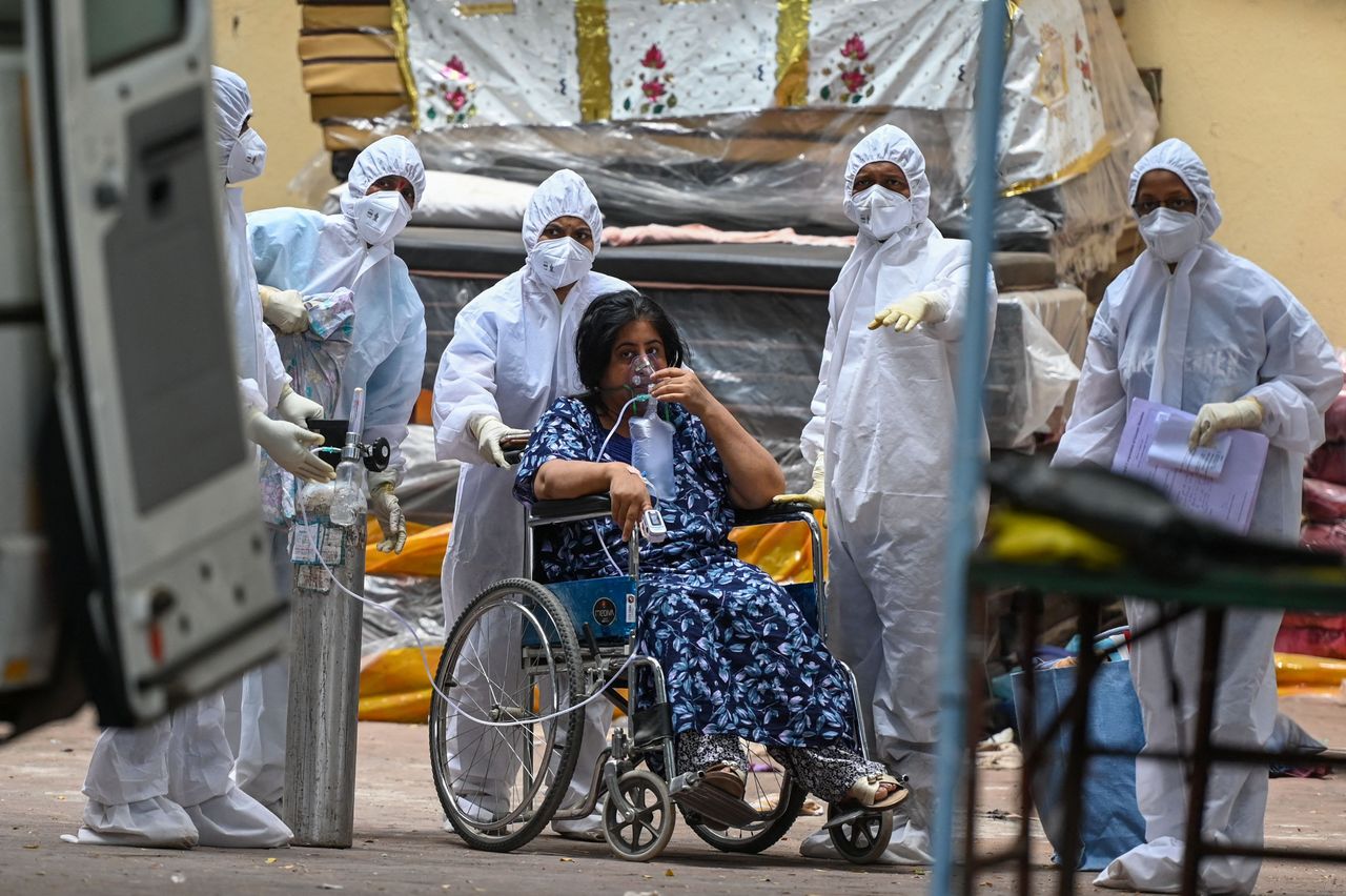 Health workers and a patient in India