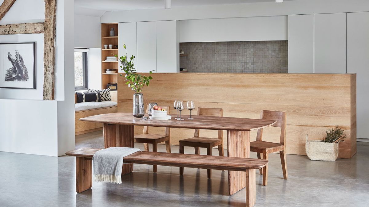 wooden dining table, bench and chairs in kitchen with wood, white and grey finishes