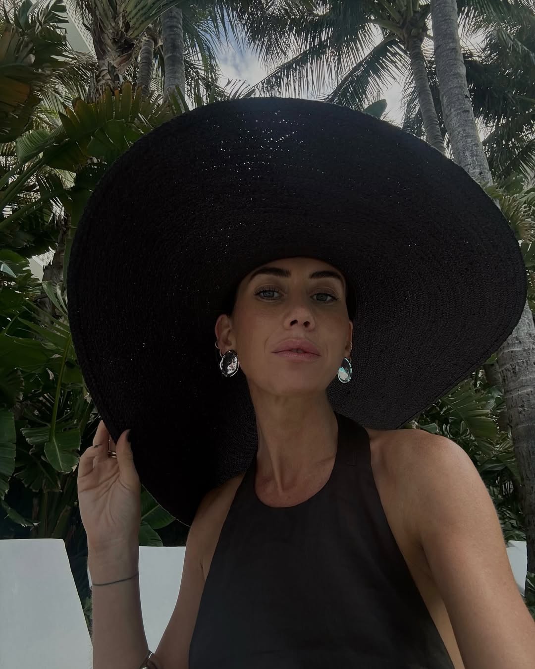 Hannah wearing straw hat