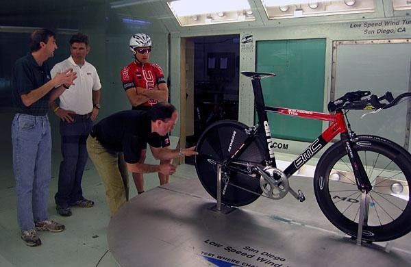 Low Speed Wind Tunnel Aerotest Engineering manager Dave Sanford (left) talked to BMC team coach Charlie Livermore while Ian McKissick's bike get's a tweak for testing