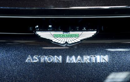 The Aston Martin logo on a car