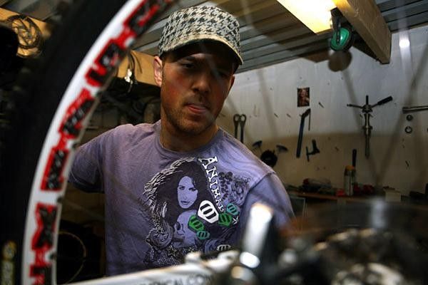 Dan Atherton works on his bike.